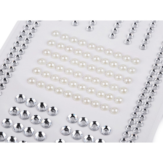 Self-adhesive rhinestones and pearl beads on an adhesive strip - Crystal (1 Card) Self-adhesive rhinestones and pearl beads on an adhesive strip - Crystal (1 Card)